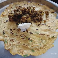 A picture of Thalipith with moong vegitable.