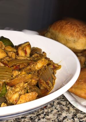 A picture of Fried pita bread with chicken masala.