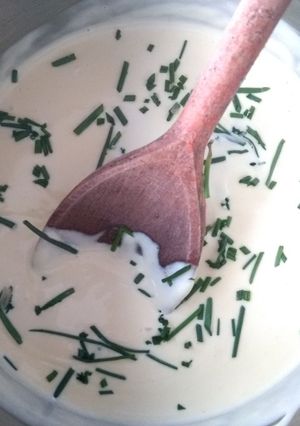 A picture of Cheese sauce with chives.