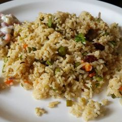 A picture of Veg Pulao with Veg Raita.