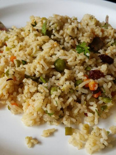 A picture of Veg Pulao with Veg Raita.