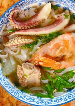 A picture of Soft Hu Tieu Noodle Soup with Pork Ribs and Seafood.