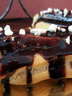 Una foto de Eclairs rellenos de crema pastelera
