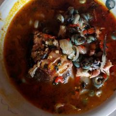 A picture of Catfish bitter leaf soup.