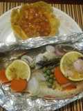 Cachamas en sus jugos con verduras y naranja acompañada de ceviche de mango en canastilla de plátano