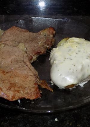 Una foto de Papas achatadas gratinadas