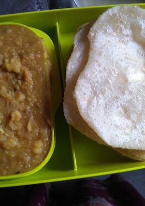 A picture of Puri and chana daal.