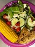 Green salad, sweet corn and baked hake