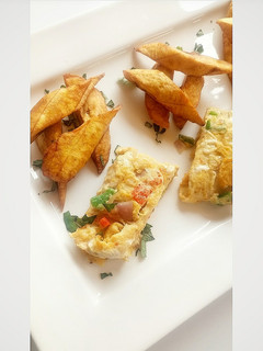 A picture of Fried plantain with fried egg.
