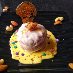 White Chocolate Mava Ghari With Saffron Sauce A picture of White Chocolate Mava Ghari With Saffron Sauce.