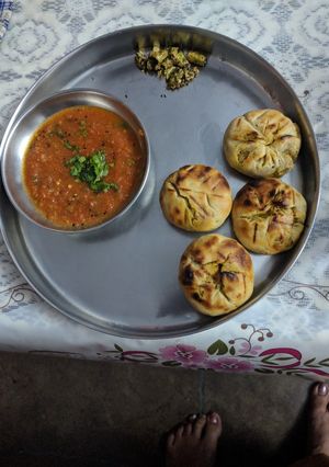 A picture of Bharwan Baati with Tomato dip(chutney).