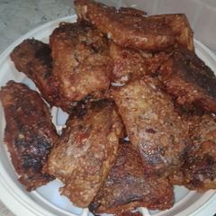 A picture of Fried Fish with crushed spices.