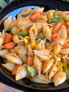 A picture of Macaroni with veggies.