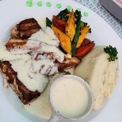 A picture of Grilled Fish (salmon) with mashed potato.