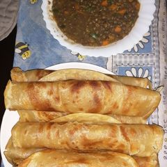 A picture of Layered chapati with kamande (one tree.