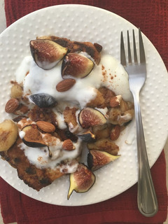 A picture of French toast hot cross buns with plain yoghurt, Caramelized bananas and figs.