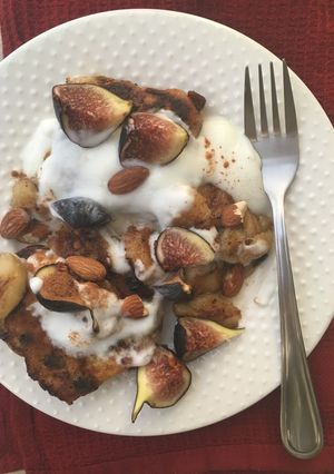 A picture of French toast hot cross buns with plain yoghurt, Caramelized bananas and figs.