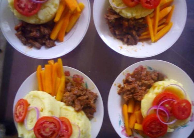 Mashed potatoes,brown lamb stew and buttered carrot