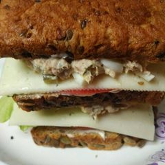A picture of Triple Stacked Egg and Tuna Sandwiches.