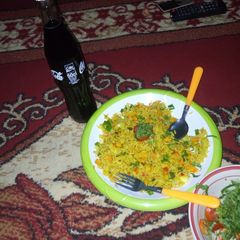 A picture of Carrots and curry fried rice.