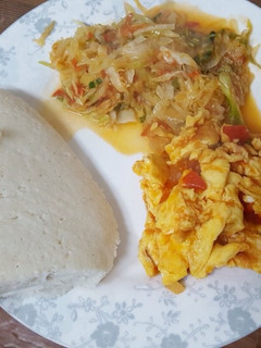 A picture of Cabbage ugali and eggs.