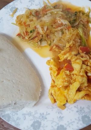 A picture of Cabbage ugali and eggs.