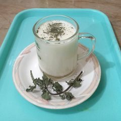 A picture of Lassi with honey and mint.