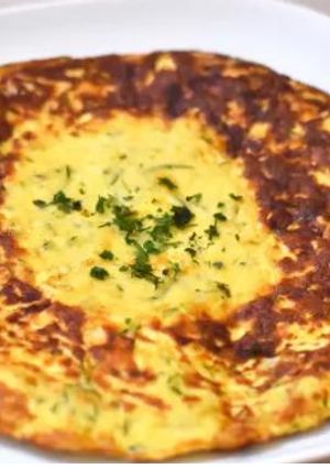 Una foto de Tortilla de calabacín y parmesano