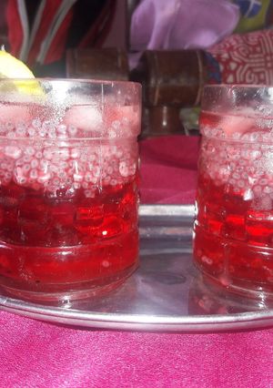 A picture of Roohafza with sabza and lemon.