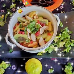 A picture of Kiwi Berry fruits with honey, lemon salad.