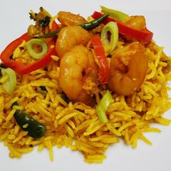 A picture of King prawns & pointed peppers biryani.