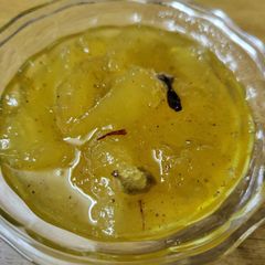 A picture of Raw mango murabba with string candy.