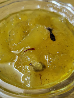 A picture of Raw mango murabba with string candy.