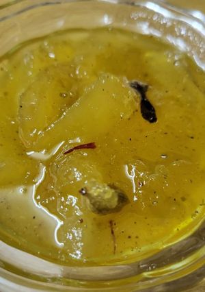 A picture of Raw mango murabba with string candy.