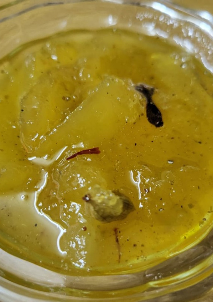 A picture of Raw mango murabba with string candy.
