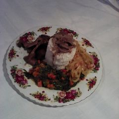 A picture of Spinach with mielie rice.