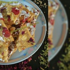 A picture of Peanut brittle with rose &cherries.