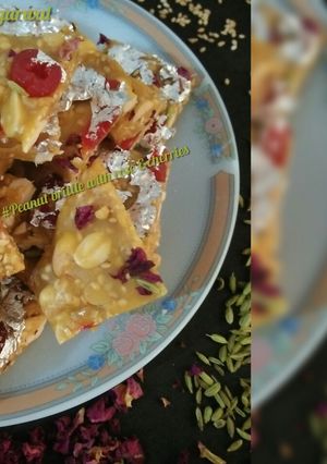 A picture of Peanut brittle with rose &cherries.