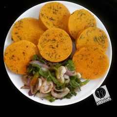 A picture of Moimoi with spinach leaves.