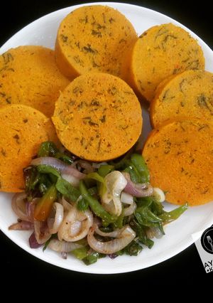 A picture of Moimoi with spinach leaves.