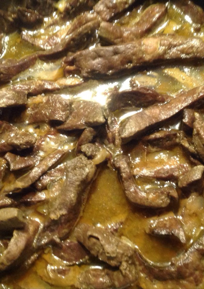 Una foto de Hígado encebollado