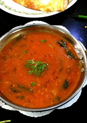 A picture of Tomato and Onion Sambar.