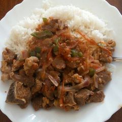 A picture of Beef Stew and White Rice.