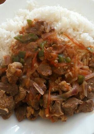 A picture of Beef Stew and White Rice.