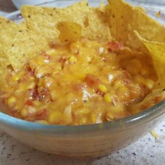 A picture of Garlic, Corn, Tomato. Mozzarella topping & Grated Cheese. Salsa.