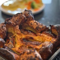 A picture of Toad in the Hole with Ale and Onion Gravy.