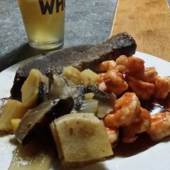 A picture of Brad's whiskey braised tri tip and chili lime prawns.