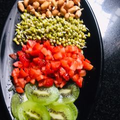 A picture of Sprouts and fruits salad.