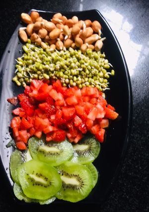 A picture of Sprouts and fruits salad.