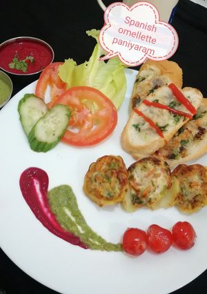 A picture of SpanishOmellettePaniyaram/ garlic bread /beetroot dip.